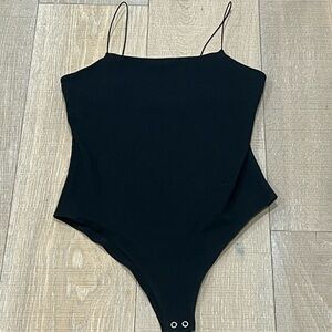 Black bodysuit with elastic straps from Target, size medium.